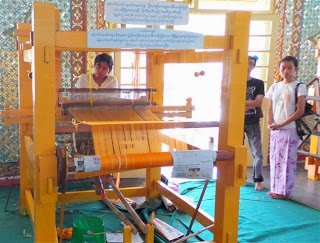 Weaving saffron coloured fabric for monks robes