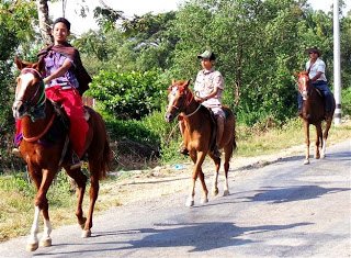 The first horse riders we'd seen with saddles