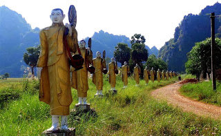 Statues along the track to the cave