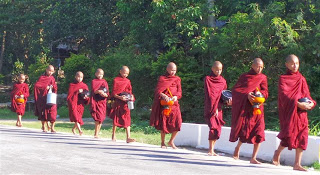 Monks setting off to beg for food